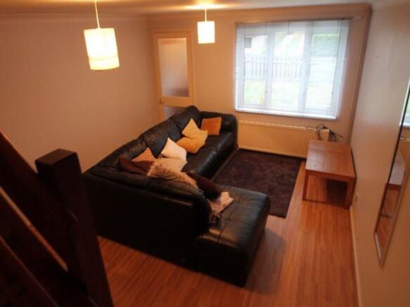 A spacious and inviting living room featuring c...