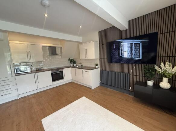 Kitchen/Living Area with 65 Inch TV