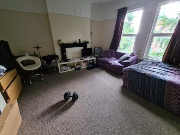 Bright and spacious master bedroom featuring a ...