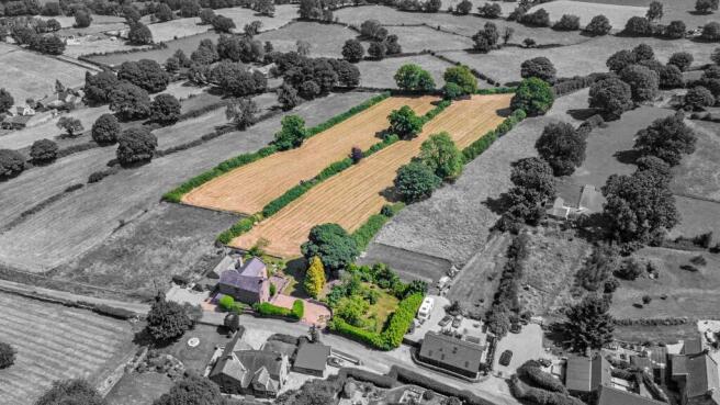 approximately 3.75 acres of gardens, orchard and adjoining paddocks
