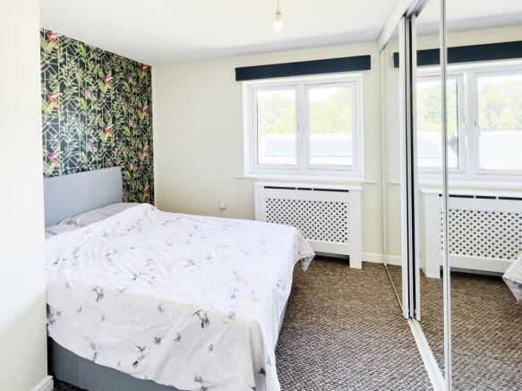 Bright, well-presented bedroom with a double be...