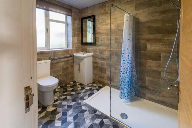 A modern bathroom featuring a large window prov...