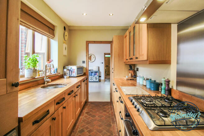 Kitchen with dining room beyond