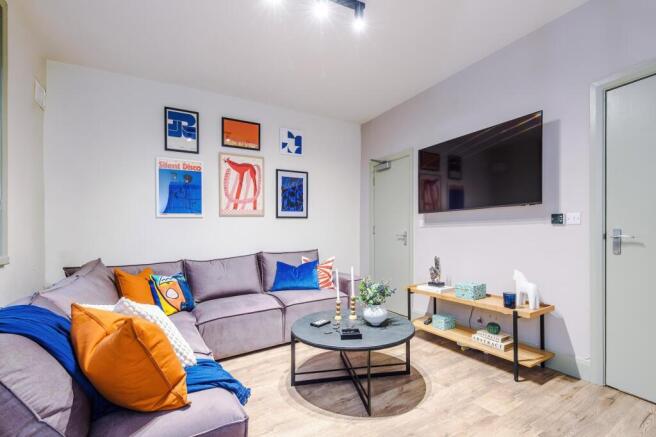 Bright, modern living room with a comfortable L...
