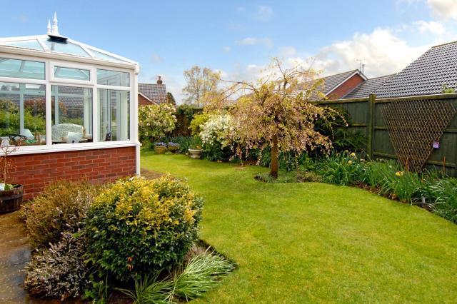 Enclosed by fencing