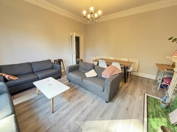 A spacious and well-maintained living room with...