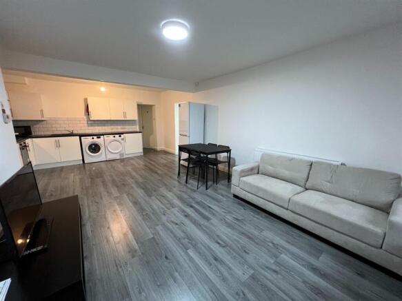 Spacious open-plan living room with dining area...