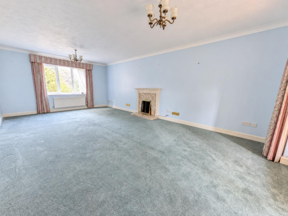Bright Empty Lounge with Classic Fireplace.png