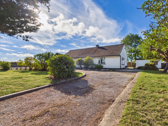 Subtle Greener Lawns Framing Driveway