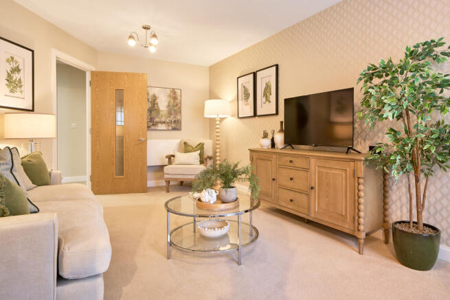a living room with a tv and furniture