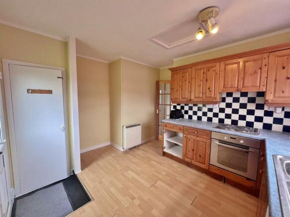 Kitchen cupboard to hallway