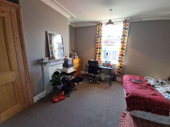 Bright and inviting master bedroom featuring a ...