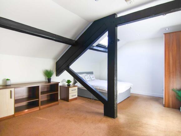 Double bedroom with exposed beams