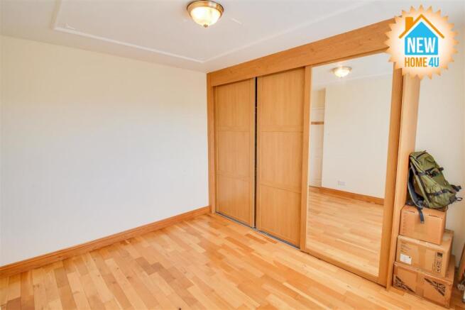 SECOND BEDROOM: