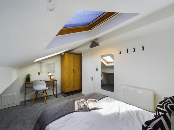 A beautifully designed double bedroom featuring...