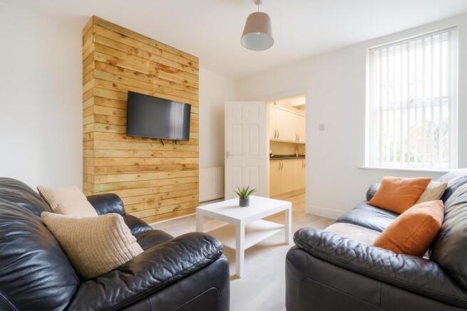 Bright and inviting living room featuring conte...