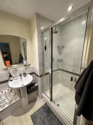 Modern bathroom featuring a spacious walk-in sh...