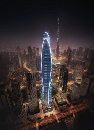 A futuristic skyscraper illuminated at night stand
