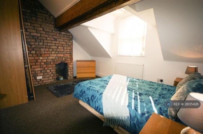 Bedroom 6 In Attic With Cool Exposed Brick