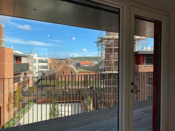 Living room views of garden & roof tops