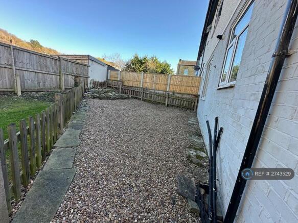 Easily Maintained Rear Garden With Small Rockery 