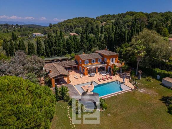 Aerial view of a Mediterranean-style villa with an