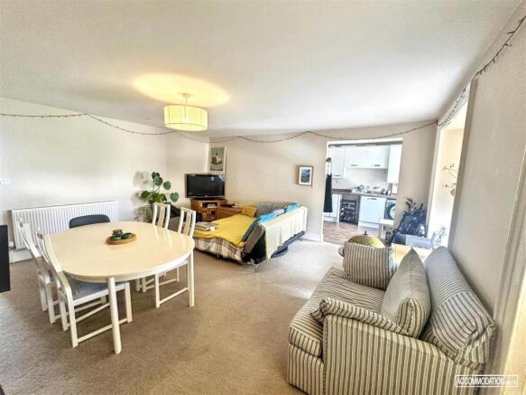 Spacious bright living room with dining area...