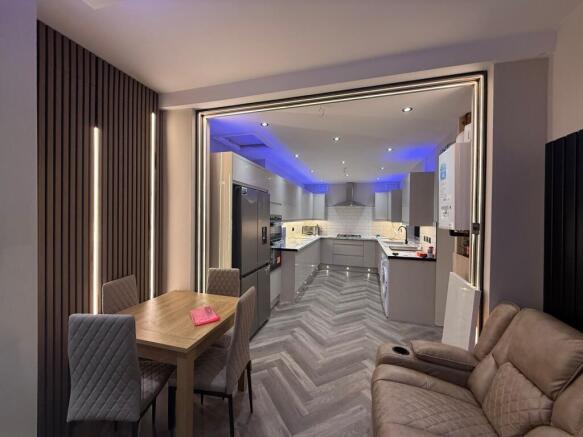 Stylish open-plan living and dining area openin...