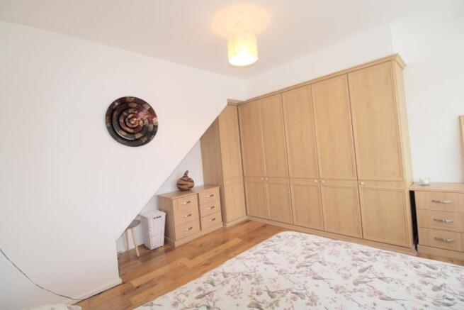 Bedroom one with fitted wardrobes