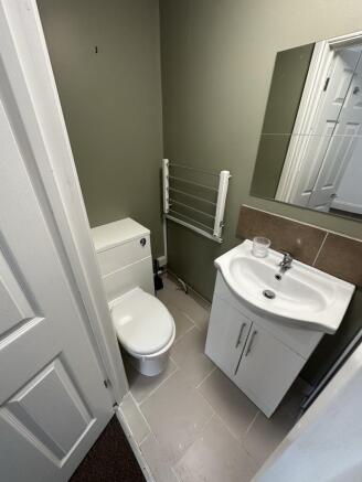 A tidy single toilet featuring modern fixtures ...