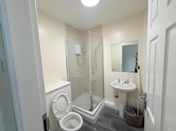 A clean and functional bathroom featuring a cor...