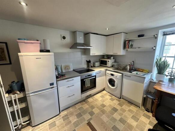 Bright modern kitchen with high-end appliances...
