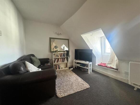 Charming living space with a bright window seat...
