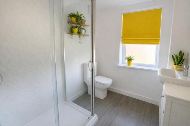 Bright, modern bathroom with a walk-in shower, ...