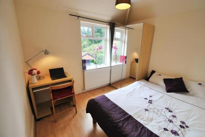 Bright bedroom with double bed and dedicated st...