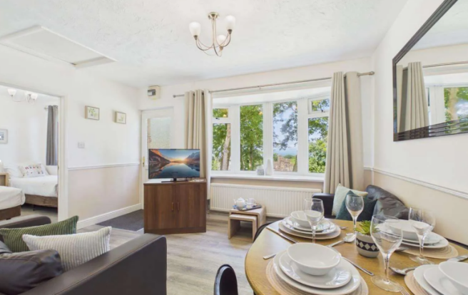 Open Plan Living And Dining Area With Partial Coas
