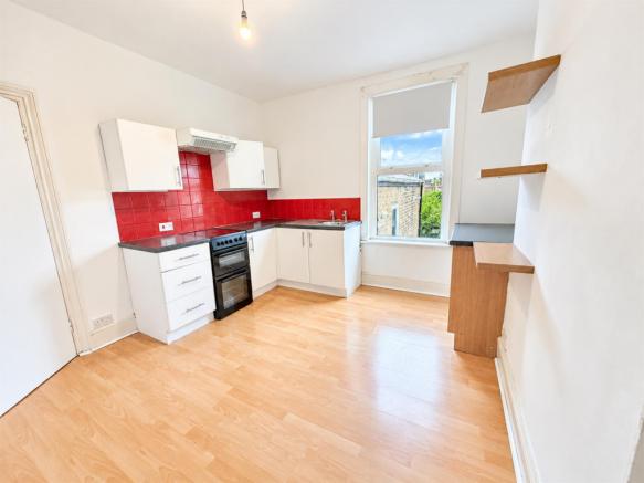 Bright Modern Kitchen with Red Tile Backsplash.png