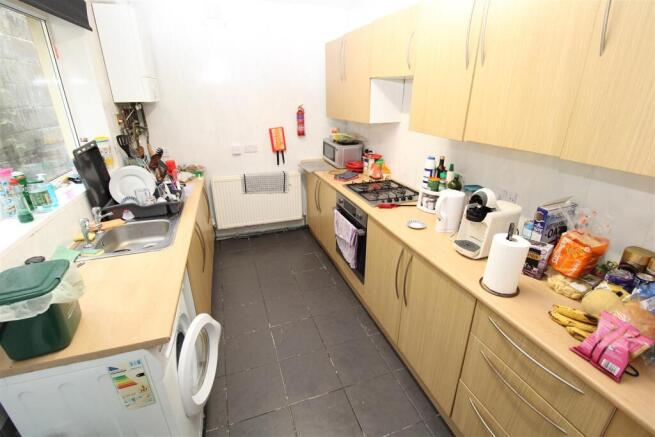 Bright kitchen with ample storage and appliance...
