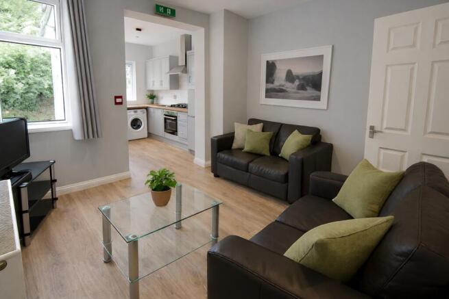 Bright lounge with leather sofas and modern déc...