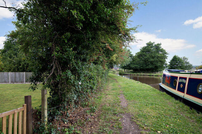 View along towpath and canal showing access from r