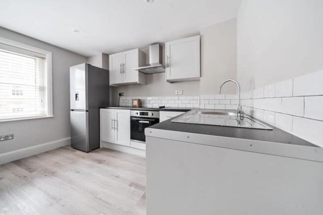 Bright modern kitchen with sleek appliances...