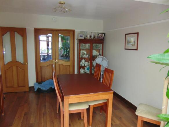 DINING ROOM OPENING TO CONSERVATORY