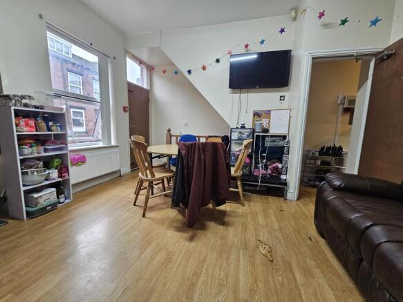 A bright and welcoming living room featuring a ...