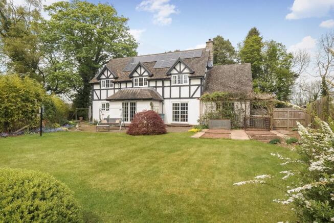 Private rear garden with terrace across the rear