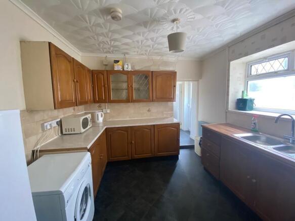 Bright kitchen with ample cabinet storage space...