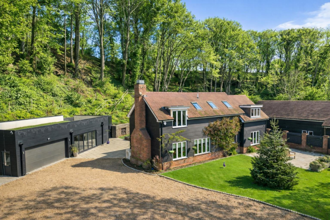 Rural home with modern outbuilding.png
