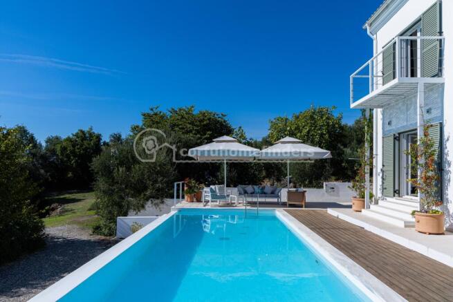 Pool and house