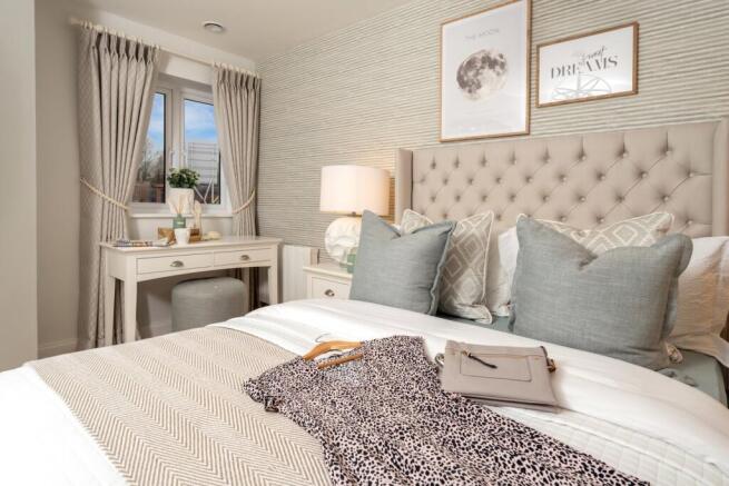 a bed with a laptop on it