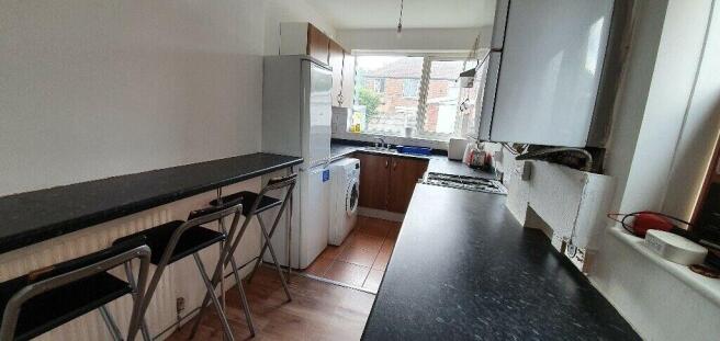 Bright kitchen with a convenient breakfast bar...