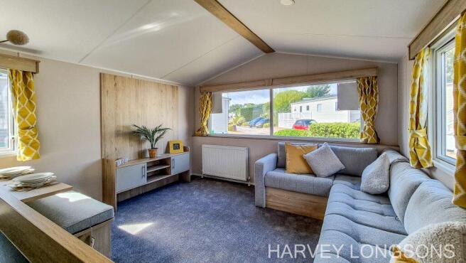 Bright lounge with L-shaped corner sofa